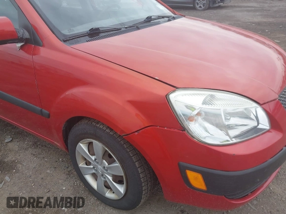 2009 Kia Rio SX with VIN KNADE223996556806, listed as a IAAI auction lot 42117938 with 54,007 mi miles. Bid and sale history available at carsss.com. Image 6.