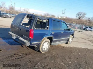 1998 Chevrolet Tahoe with VIN 1GNEK13R4WJ371916, listed as a IAAI auction lot 41689311 with 120,749 mi miles. Bid and sale history available at carsss.com. Image 4.