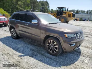 2017 Jeep Grand Cherokee Overland with VIN 1C4RJECG1HC868559, listed as a Copart auction lot 52569595 with 168,226 mi miles and Clean Title. Bid and sale history available at carsss.com. Image 4.