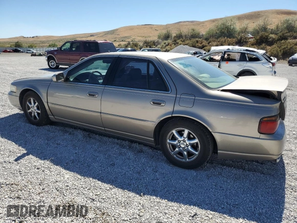 2000 Cadillac Seville Touring STS z VIN 1G6KY5498YU255607, wystawiony jako Copart lot #71130714 z przebiegiem 146 046 mil mil oraz Szkoda całkowita • Salvage title. Historia ofert i sprzedaży dostępna na DreamBid. Obrazek 2.