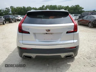 2019 Cadillac XT4 FWD Premium Luxury z VIN 1GYFZCR44KF195554, wystawiony jako Copart lot #55728095 z przebiegiem 35 948 mil mil oraz Nie do naprawy. Historia ofert i sprzedaży dostępna na DreamBid. Obrazek 6.