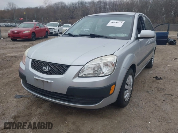 2009 Kia Rio LX with VIN KNADE243596544181, listed as a IAAI auction lot 41876733 with 200,216 mi miles. Bid and sale history available at carsss.com. Image 2.
