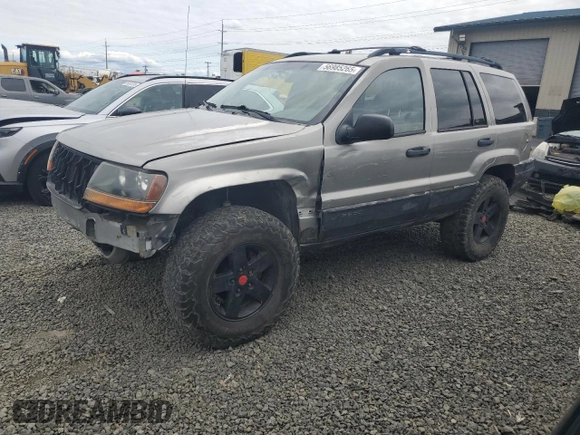 2000 Jeep Grand Cherokee Laredo with VIN 1J4GW48S9YC390448, listed as a Copart auction lot 56985265 with Not provided miles and Salvage title. Bid and sale history available at DreamBid. Image 1.