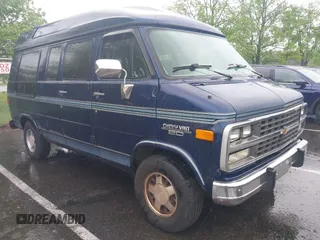 1995 Chevrolet Chevy Van z VIN 1GBEG25K0SF177840, wystawiony jako IAAI lot #42251083 z przebiegiem 114 495 mil mil oraz . Historia ofert i sprzedaży dostępna na DreamBid. Obrazek 1.