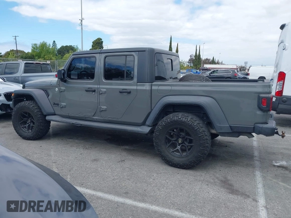2020 Jeep Gladiator Sport S z VIN 1C6HJTAG4LL153441, wystawiony jako IAAI lot #42052329 z przebiegiem 34 660 mil mil oraz . Historia ofert i sprzedaży dostępna na DreamBid. Obrazek 14.