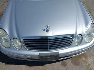2005 Mercedes-Benz E-Class 3.2L with VIN WDBUF65J15A669561, listed as a IAAI auction lot 41888887 with 87,317 mi miles. Bid and sale history available at carsss.com. Image 6.