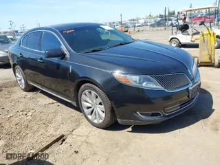 2014 Lincoln MKS with VIN 1LNHL9DK0EG600330, listed as a IAAI auction lot 41953968 with 228,668 mi miles. Bid and sale history available at carsss.com. Image 1.