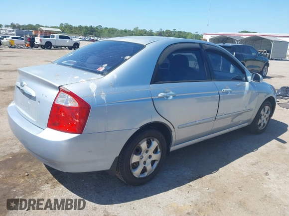 2005 Kia Spectra LX with VIN KNAFE121955107403, listed as a IAAI auction lot 42055036 with 157,605 mi miles. Bid and sale history available at carsss.com. Image 4.
