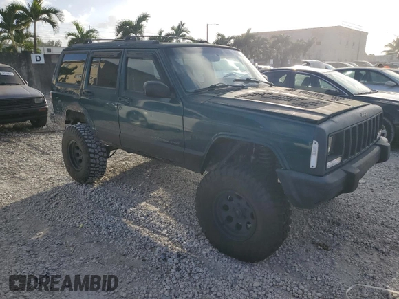 1998 Jeep Cherokee Country with VIN 1J4FT78S8XL520854, listed as a Copart auction lot 79304214 with 111,674 mi miles and Clean title. Bid and sale history available at DreamBid. Image 4.