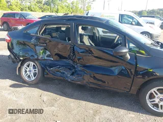 2019 Ford Fiesta SE z VIN 3FADP4BJ2KM159022, wystawiony jako IAAI lot #42269813 z przebiegiem 55 107 mil mil oraz . Historia ofert i sprzedaży dostępna na DreamBid. Obrazek 6.