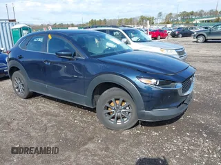 2023 Mazda CX-30 S with VIN 3MVDMBAM1PM583896, listed as a IAAI auction lot 41732091 with 26,298 mi miles and . Bid and sale history available at carsss.com. Image 1.