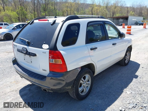 2006 Kia Sportage LX with VIN KNDJF723567151614, listed as a IAAI auction lot 42022102 with 128,564 mi miles and . Bid and sale history available at carsss.com. Image 4.