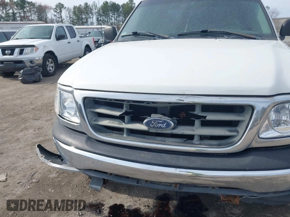 2000 Ford F-150 XL with VIN 1FTRX17LXYNC39983, listed as a IAAI auction lot 41750277 with 170,016 mi miles. Bid and sale history available at carsss.com. Image 6.