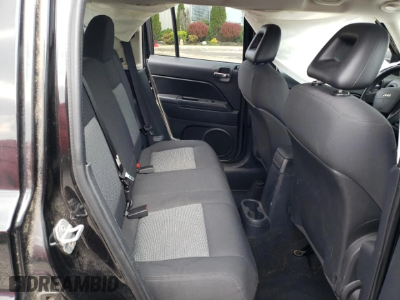 2009 Jeep Patriot Sport z VIN 1J4FF28B19D107312, wystawiony jako Copart lot #52885605 z przebiegiem 149 985 mil mil oraz Nie do naprawy • Non repairable. Historia ofert i sprzedaży dostępna na DreamBid. Obrazek 11.