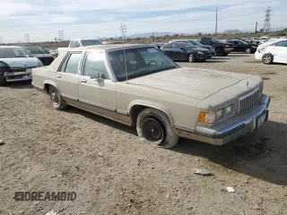 1991 Mercury Grand Marquis z VIN 2MECM75FXMX633893, wystawiony jako Copart lot #87439324 z przebiegiem 65 046 mil mil oraz Tytuł czysty. Historia ofert i sprzedaży dostępna na DreamBid. Obrazek 4.