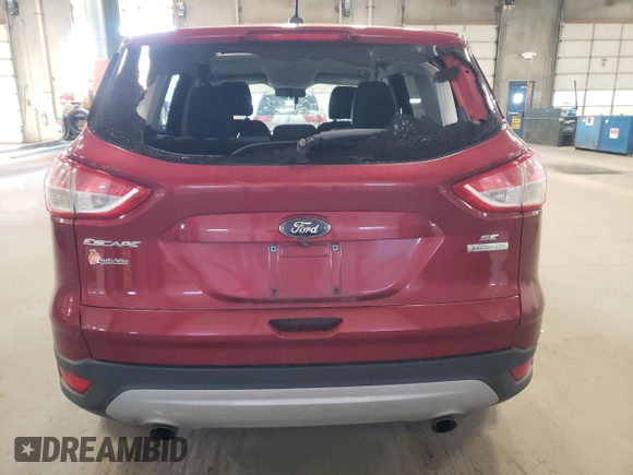 2016 Ford Escape SE with VIN 1FMCU0GX1GUA70710, listed as a Copart auction lot 52299925 with 205,760 mi miles and Salvage Title. Bid and sale history available at carsss.com. Image 6.