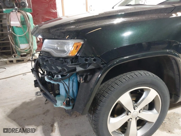 2014 Jeep Grand Cherokee Overland with VIN 1C4RJFCGXEC162109, listed as a IAAI auction lot 41943979 with 147,788 mi miles. Bid and sale history available at carsss.com. Image 6.