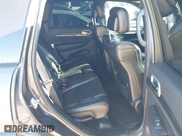 2018 Jeep Grand Cherokee Trailhawk with VIN 1C4RJFLT9JC244212, listed as a IAAI auction lot 41443469 with 77,953 mi miles and . Bid and sale history available at DreamBid. Image 8.