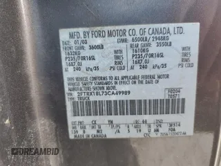 2003 Ford F-150 XL with VIN 2FTRX18L73CA49989, listed as a Copart auction lot 57434025 with 141,876 mi miles and Salvage title. Bid and sale history available at DreamBid. Image 12.