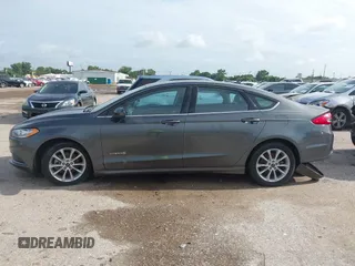 2017 Ford Fusion Hybrid SE with VIN 3FA6P0LU5HR336779, listed as a IAAI auction lot 42691789 with 140,720 mi miles and . Bid and sale history available at DreamBid. Image 14.