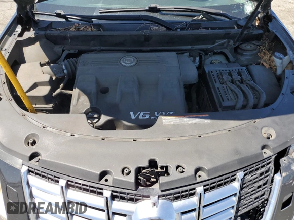 2014 Cadillac SRX Performance Collection z VIN 3GYFNCE36ES687267, wystawiony jako Copart lot #58242255 z przebiegiem 167 577 mil mil oraz Szkoda całkowita • Salvage title. Historia ofert i sprzedaży dostępna na DreamBid. Obrazek 12.