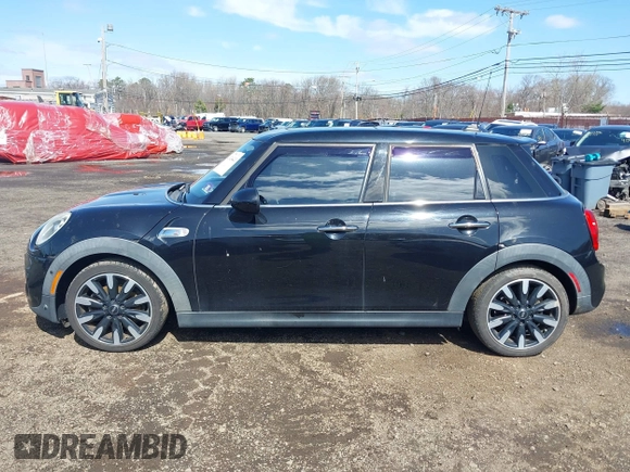 2017 MINI Hardtop 4 Door Cooper S z VIN WMWXU3C39H2F48699, wystawiony jako IAAI lot #41924423 z przebiegiem 81 249 mil mil oraz . Historia ofert i sprzedaży dostępna na DreamBid. Obrazek 14.