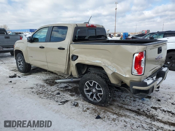 2021 GMC Canyon 4WD AT4 z VIN 1GTG6FEN8M1157828, wystawiony jako Copart lot #88392435 z przebiegiem 45 252 mil mil oraz Szkody całkowita. Historia ofert i sprzedaży dostępna na DreamBid. Obrazek 2.