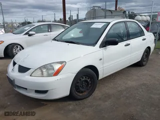 2004 Mitsubishi Lancer ES with VIN JA3AJ26E74U060371, listed as a IAAI auction lot 41636927 with 165,456 mi miles. Bid and sale history available at carsss.com. Image 17.