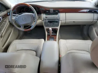 2004 Cadillac DeVille DTS z VIN 1G6KF579X4U212415, wystawiony jako Copart lot #58005555 z przebiegiem 97 663 mil mil oraz Tytuł czysty. Historia ofert i sprzedaży dostępna na DreamBid. Obrazek 8.