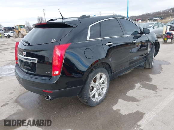 2013 Cadillac SRX Performance Collection with VIN 3GYFNHE34DS595277, listed as a IAAI auction lot 41618126 with 118,141 mi miles. Bid and sale history available at carsss.com. Image 4.