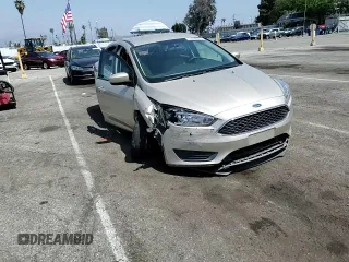 2018 Ford Focus SE z VIN 1FADP3F23JL303948, wystawiony jako Copart lot #55698915 z przebiegiem 85 500 mil mil oraz Szkoda całkowita • Salvage title. Historia ofert i sprzedaży dostępna na DreamBid. Obrazek 13.
