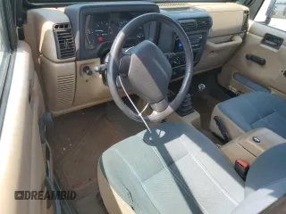 1999 Jeep Wrangler Sahara z VIN 1J4FY49S0XP453920, wystawiony jako Copart lot #61808475 z przebiegiem 129 062 mil mil oraz Czysty tytuł • Clean title. Historia ofert i sprzedaży dostępna na DreamBid. Obrazek 8.