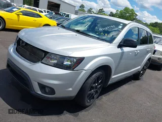 2014 Dodge Journey SXT with VIN 3C4PDCBB0ET281861, listed as a IAAI auction lot 42187485 with 124,191 mi miles and . Bid and sale history available at DreamBid. Image 2.