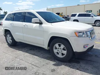 2011 Jeep Grand Cherokee Laredo with VIN 1J4RS4GG0BC573388, listed as a IAAI auction lot 42167064 with 63,363 mi miles and . Bid and sale history available at DreamBid. Image 1.