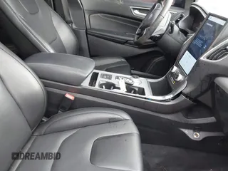 2021 Ford Edge Titanium z VIN 2FMPK4K94MBA32297, wystawiony jako IAAI lot #41834740 z przebiegiem 45 908 mil mil oraz . Historia ofert i sprzedaży dostępna na DreamBid. Obrazek 5.