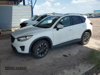 2016 Mazda CX-5 Grand Touring z VIN JM3KE2DY7G0658521, wystawiony jako Copart lot #58628945 z przebiegiem 159 966 mil mil oraz Czysty tytuł • Clean title. Historia ofert i sprzedaży dostępna na DreamBid. Obrazek 1.