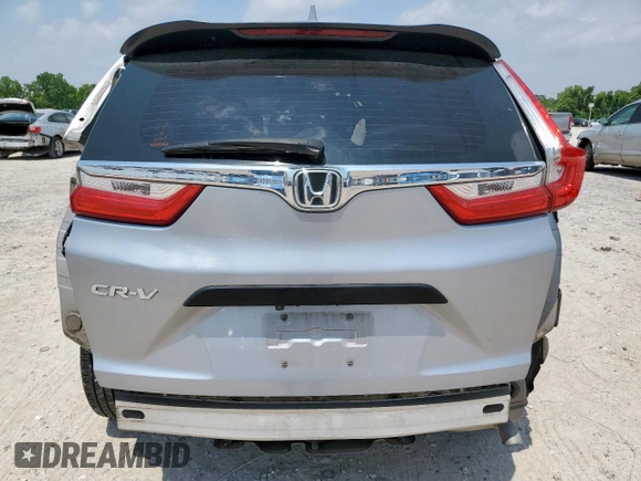 2019 Honda CR-V LX z VIN 2HKRW5H32KH406837, wystawiony jako Copart lot #57111585 z przebiegiem 123 047 mil mil oraz Szkoda całkowita • Salvage title. Historia ofert i sprzedaży dostępna na DreamBid. Obrazek 6.