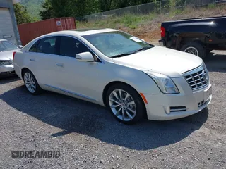 2015 Cadillac XTS Luxury z VIN 2G61N5S33F9172115, wystawiony jako IAAI lot #42148122 z przebiegiem 100 924 mil mil oraz . Historia ofert i sprzedaży dostępna na DreamBid. Obrazek 1.