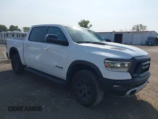 2022 Ram 1500 Rebel z VIN 1C6SRFLTXNN338532, wystawiony jako IAAI lot #40486860 z przebiegiem 30 410 mil mil oraz . Historia ofert i sprzedaży dostępna na DreamBid. Obrazek 1.