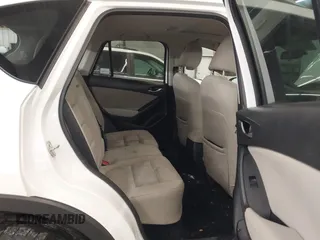 2014 Mazda CX-5 Touring with VIN JM3KE4CY4E0321055, listed as a IAAI auction lot 41613593 with 174,339 mi miles. Bid and sale history available at carsss.com. Image 8.