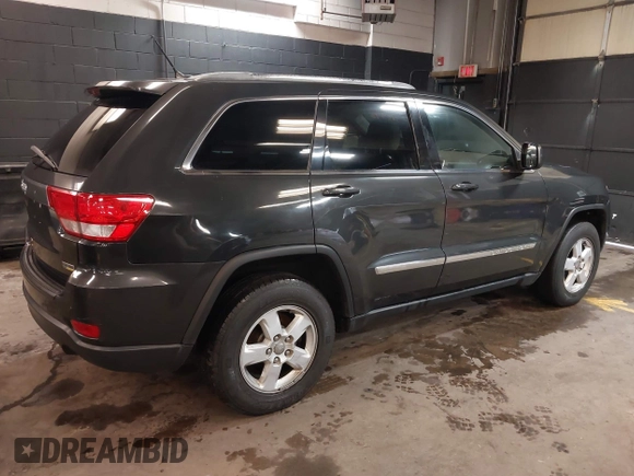 2011 Jeep Grand Cherokee 70th Anniversary with VIN 1J4RR4GG3BC566690, listed as a IAAI auction lot 41810545 with 173,886 mi miles. Bid and sale history available at carsss.com. Image 4.