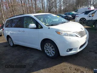 2014 Toyota Sienna Ltd with VIN 5TDDK3DC9ES081022, listed as a IAAI auction lot 41183921 with 1 mi miles. Bid and sale history available at carsss.com. Image 1.