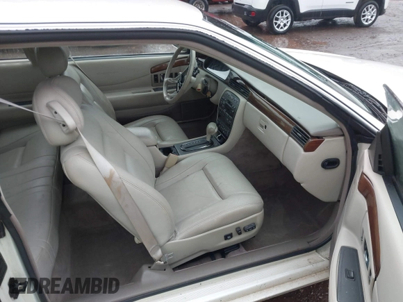 1997 Cadillac Eldorado ESC z VIN 1G6EL12Y6VU614754, wystawiony jako IAAI lot #41543611 z przebiegiem 73 273 mil mil oraz . Historia ofert i sprzedaży dostępna na DreamBid. Obrazek 5.