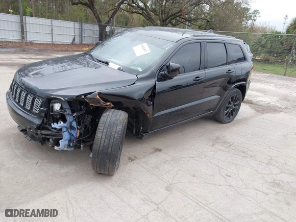 2018 Jeep Grand Cherokee Laredo E with VIN 1C4RJFAG7JC312948, listed as a IAAI auction lot 41624027 with 116,763 mi miles. Bid and sale history available at carsss.com. Image 2.