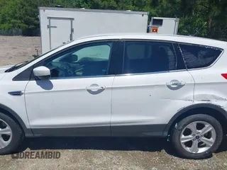 2014 Ford Escape SE with VIN 1FMCU9G90EUB76911, listed as a IAAI auction lot 42143518 with 123,466 mi miles and . Bid and sale history available at DreamBid. Image 14.