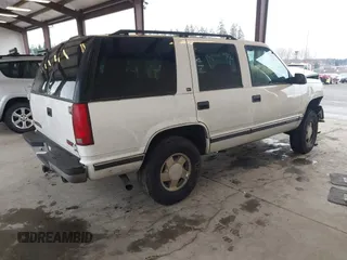 1998 GMC Yukon with VIN 1GKEK13R7WJ700881, listed as a IAAI auction lot 41507538 with 188,396 mi miles. Bid and sale history available at carsss.com. Image 4.