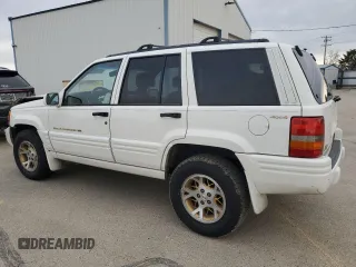 1998 Jeep Grand Cherokee Limited with VIN 1J4GZ78Y5WC259043, listed as a Copart auction lot 43976955 with 212,910 mi miles and Salvage Title. Bid and sale history available at carsss.com. Image 2.