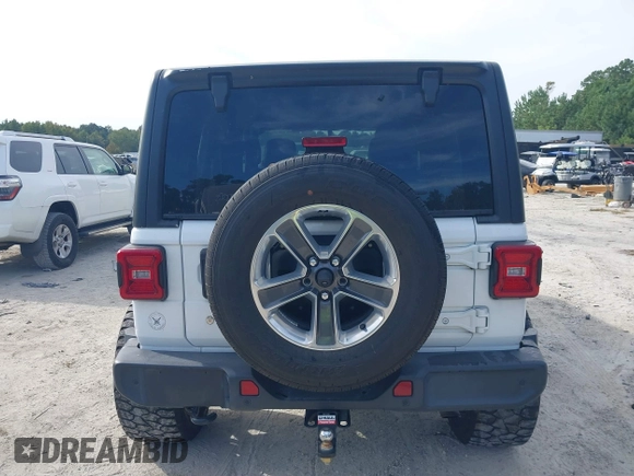 2018 Jeep Wrangler Unlimited Sahara z VIN 1C4HJXEG4JW220092, wystawiony jako IAAI lot #40522478 z przebiegiem 90 529 mil mil oraz . Historia ofert i sprzedaży dostępna na DreamBid. Obrazek 16.