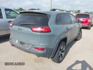 2014 Jeep Cherokee Trailhawk z VIN 1C4PJMBS2EW161276, wystawiony jako IAAI lot #42283358 z przebiegiem 135 201 mil mil oraz . Historia ofert i sprzedaży dostępna na DreamBid. Obrazek 4.