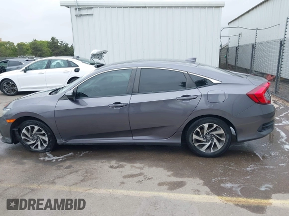 2017 Honda Civic EX z VIN 19XFC2F79HE036578, wystawiony jako IAAI lot #42380559 z przebiegiem 73 943 mil mil oraz . Historia ofert i sprzedaży dostępna na DreamBid. Obrazek 14.